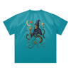Serpent and galaxy themed graphic on peacock blue cotton tee