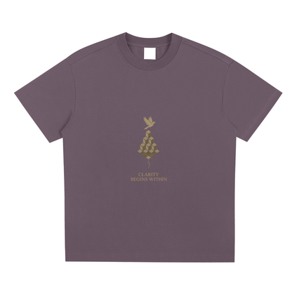 Plum purple front view of Mind Bloom tee with golden head and bird motif on soft cotton blend
