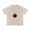 Front view of Love Is Pain graphic t-shirt showing bleeding rose wrapped in barbed wire – Stitro unisex design Apricot

