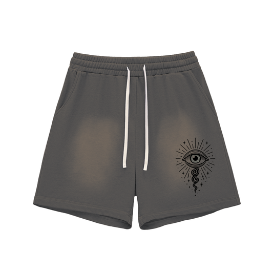 Dark gray graphic shorts featuring mystical eye illustration on front