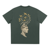 Back print of imaginative bird-leaf swirl rising from abstract head on green oversized tee

