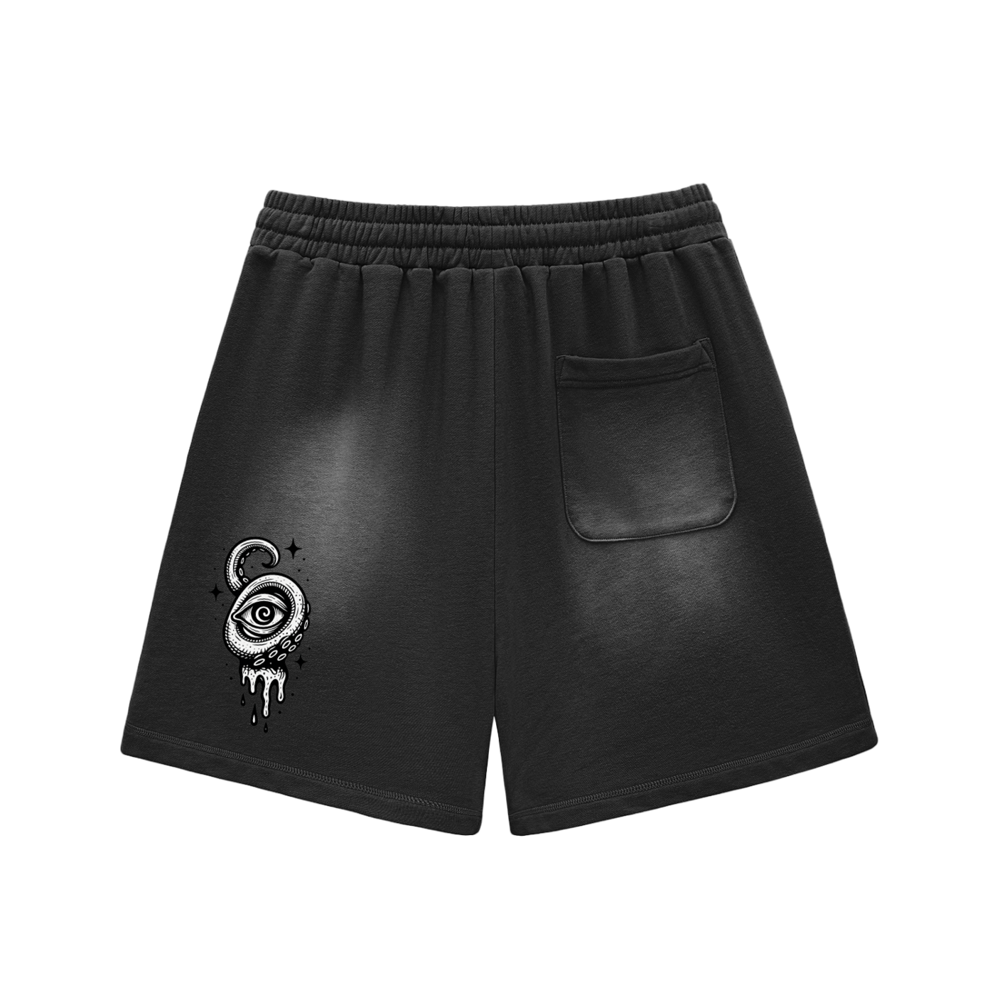 Black shorts with symbolic eye and tentacle design on the back