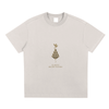 Apricot front display of Mind Bloom tee with elegant golden art print
