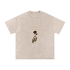 Front print of Masked Silence tee showing skeleton hand holding red rose beneath a silent quote on washed black cotton Apricot


