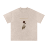Front print of Masked Silence tee showing skeleton hand holding red rose beneath a silent quote on washed black cotton Apricot

